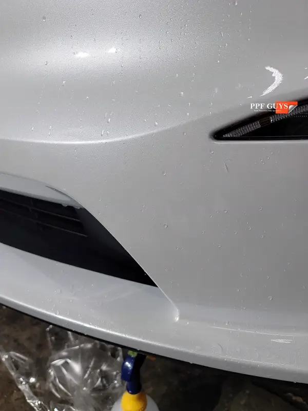 White Tesla Model X, Front end, rear bumper. Photo 11 of 15.