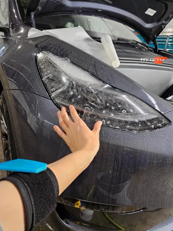 Silver Tesla Model Y, Full body Ultimate Fusion, blacked out emblems. Photo 23 of 45.