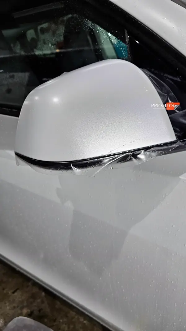White Tesla Model Y Performance, Stealth, emblems. Photo 56 of 60.