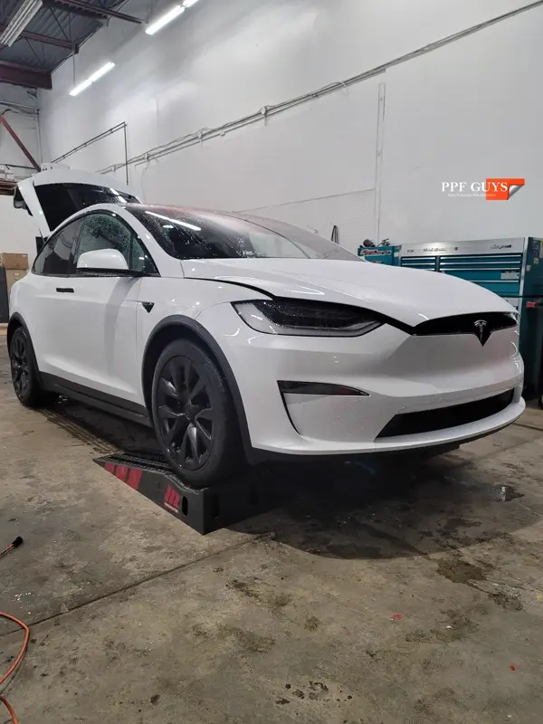 White Tesla Model X, Front end, rear bumper