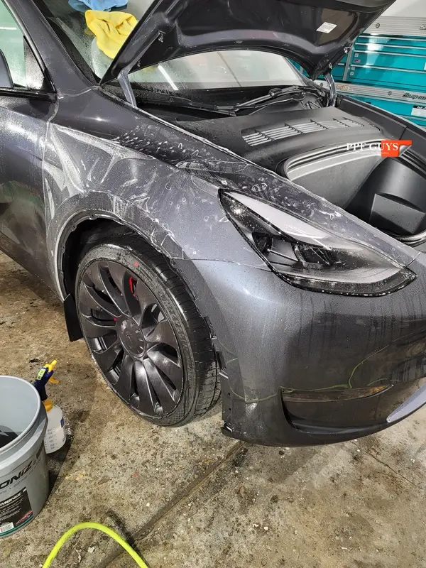 Silver Tesla Model Y, Full body Ultimate Fusion, blacked out emblems. Photo 42 of 45.