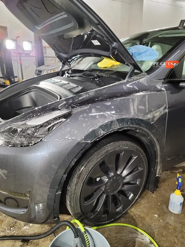 Silver Tesla Model Y, Full body Ultimate Fusion, blacked out emblems. Photo 43 of 45.