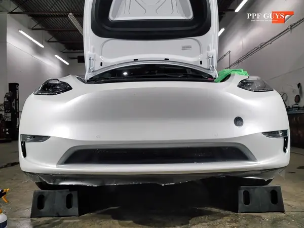 White Tesla Model Y, XPEL Stealth, ceramic, painted emblems. Photo 12 of 34.