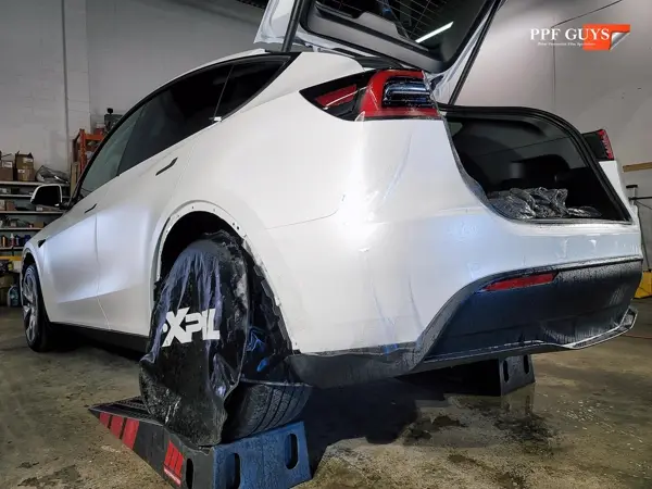 White Tesla Model Y, XPEL Stealth, ceramic, painted emblems. Photo 10 of 34.