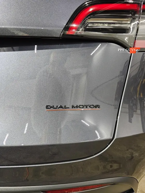 Silver Tesla Model Y, Full body Ultimate Fusion, blacked out emblems. Photo 37 of 45.