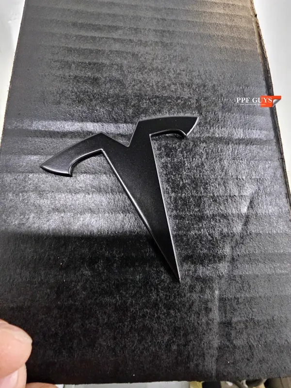 White Tesla Model Y Performance, Stealth, emblems. Photo 14 of 60.