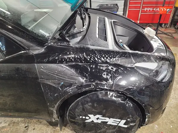 Black Tesla Model Y, Front end. Photo 12 of 14.
