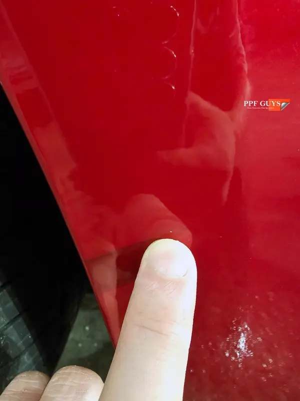 Red Tesla Model 3, Front end, partial A-pillars and rockers. Photo 28 of 30.