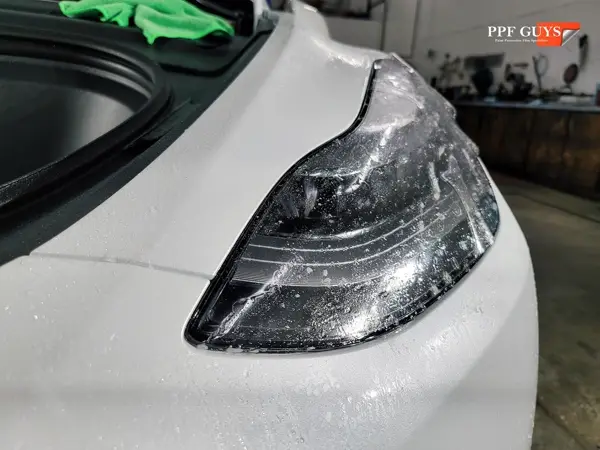 White Tesla Model Y, XPEL Stealth, ceramic, painted emblems. Photo 13 of 34.