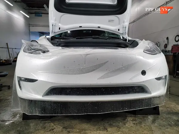 White Tesla Model Y, XPEL Stealth, ceramic, painted emblems