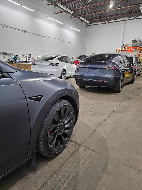 Silver Tesla Model Y, Full body Ultimate Fusion, blacked out emblems. Photo 10 of 45.