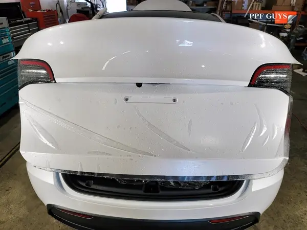 White Tesla Model Y, XPEL Stealth, ceramic, painted emblems. Photo 9 of 34.