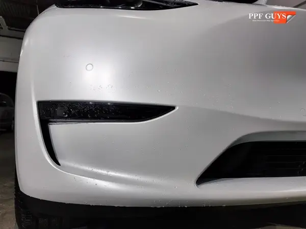 White Tesla Model Y, XPEL Stealth, ceramic, painted emblems. Photo 29 of 34.