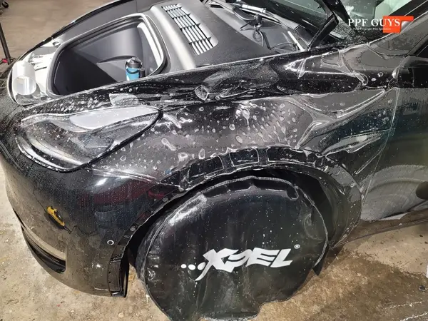Black Tesla Model Y, Front end. Photo 13 of 14.