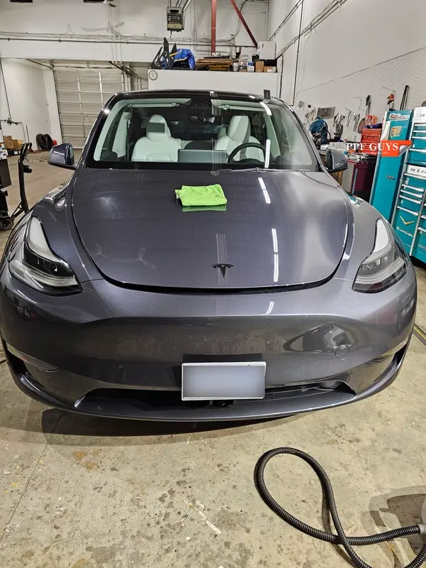 Silver Tesla Model Y, Full body Ultimate Fusion, blacked out emblems. Photo 39 of 45.