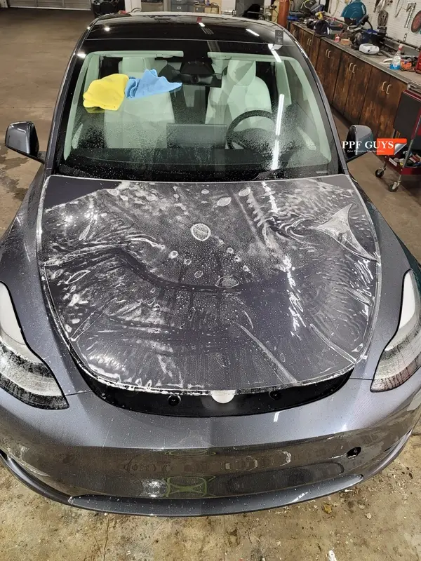 Silver Tesla Model Y, Full body Ultimate Fusion, blacked out emblems. Photo 41 of 45.