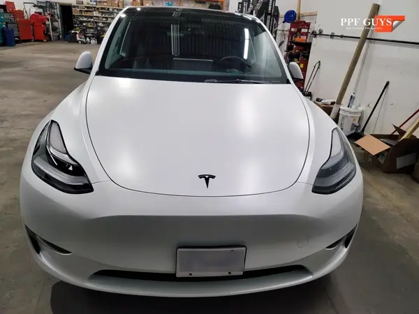 White Tesla Model Y, XPEL Stealth, ceramic, painted emblems. Photo 28 of 34.