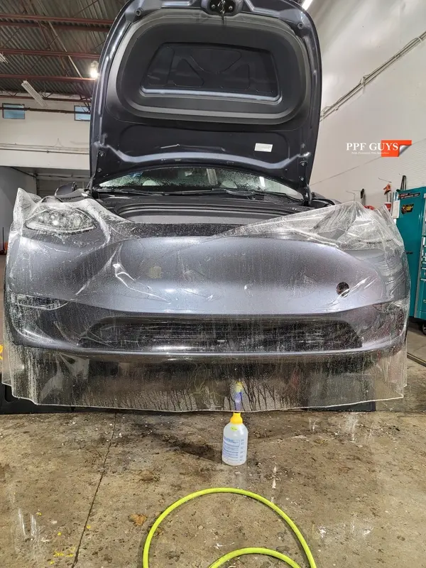 Silver Tesla Model Y, Full body Ultimate Fusion, blacked out emblems. Photo 22 of 45.
