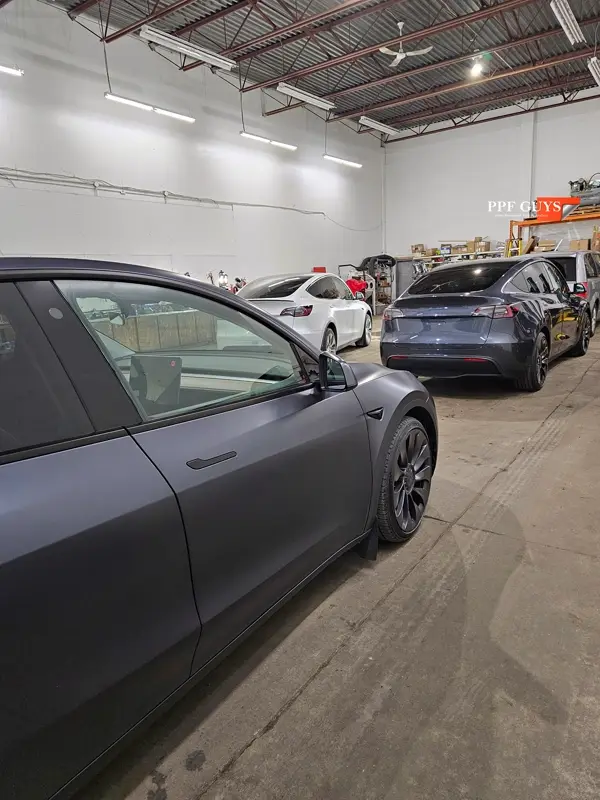 Silver Tesla Model Y, Full body Ultimate Fusion, blacked out emblems. Photo 9 of 45.