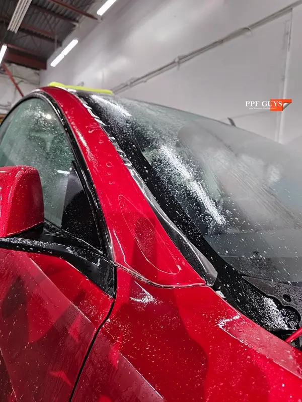 Red Tesla Model 3, Front end, partial A-pillars and rockers. Photo 24 of 30.
