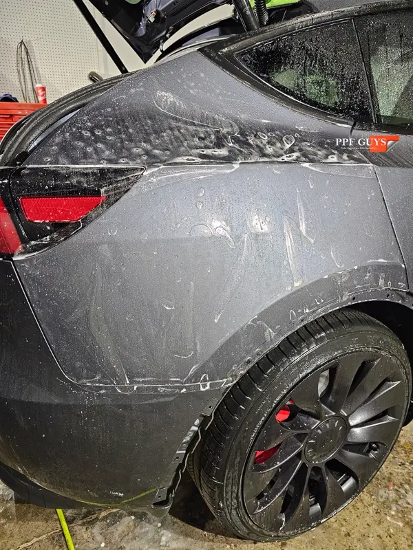 Silver Tesla Model Y, Full body Ultimate Fusion, blacked out emblems. Photo 32 of 45.