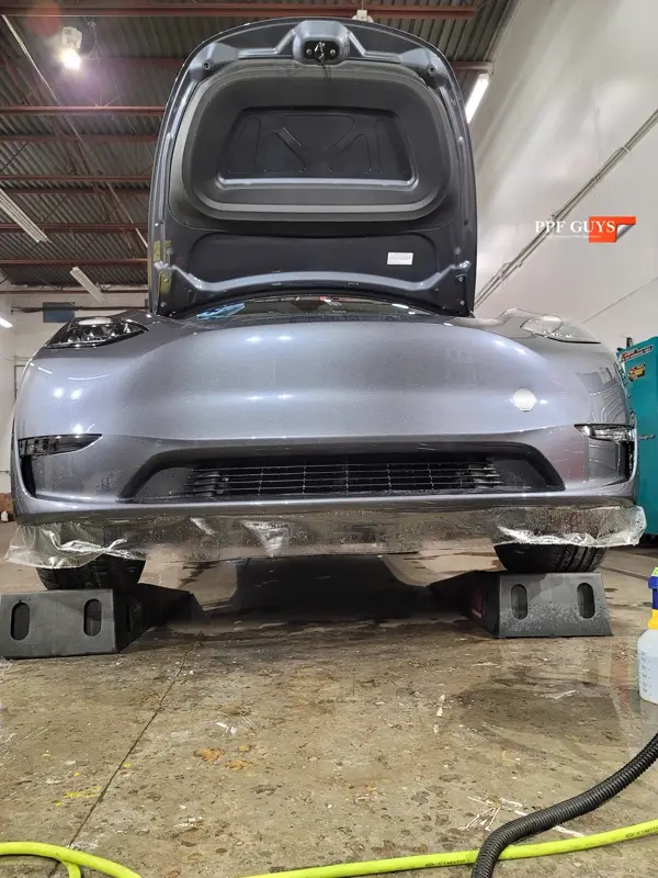 Silver Tesla Model Y, Full body Ultimate Fusion, blacked out emblems. Photo 33 of 45.