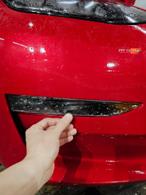 Red Tesla Model 3, Front end, partial A-pillars and rockers. Photo 14 of 30.