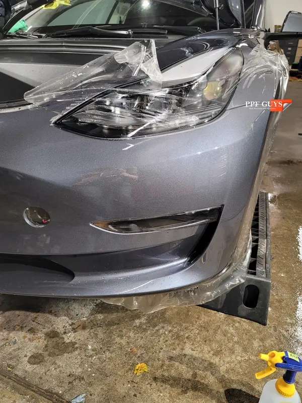 Silver Tesla Model 3, Front end and rear fenders. Photo 15 of 16.