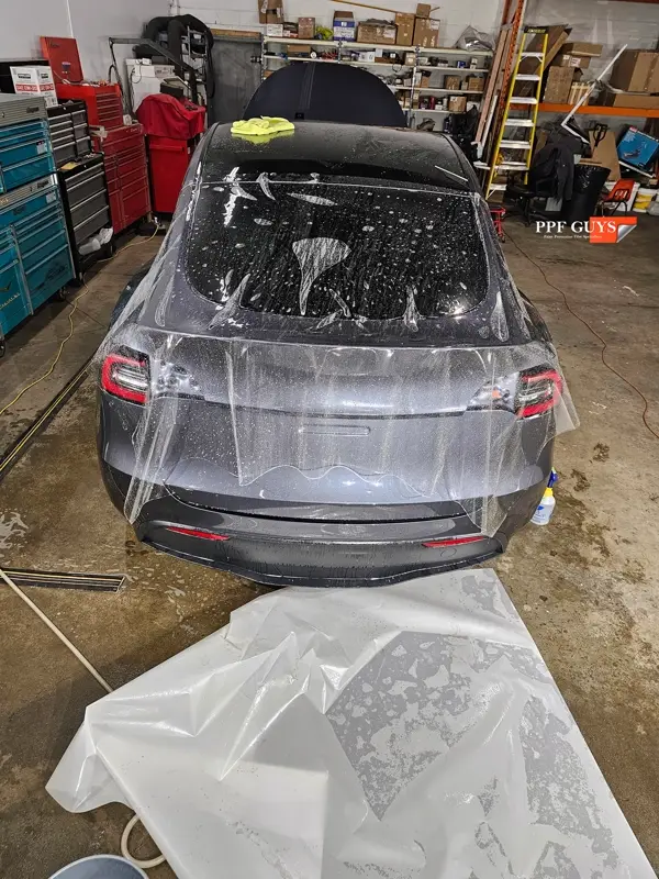 Silver Tesla Model Y, Full body Ultimate Fusion, blacked out emblems. Photo 29 of 45.