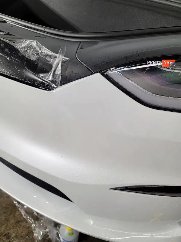 White Tesla Model X, Front end, rear bumper. Photo 12 of 15.