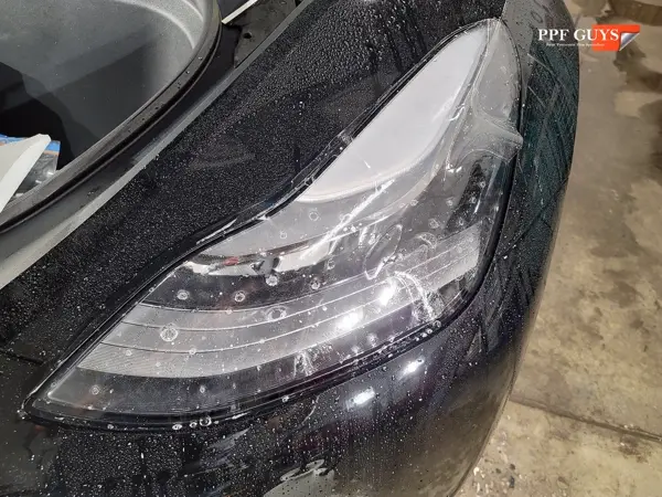 Black Tesla Model Y, Front end. Photo 14 of 14.