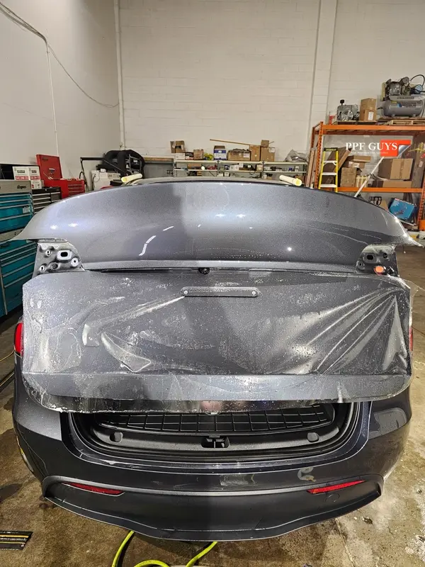 Silver Tesla Model Y, Full body Ultimate Fusion, blacked out emblems. Photo 30 of 45.