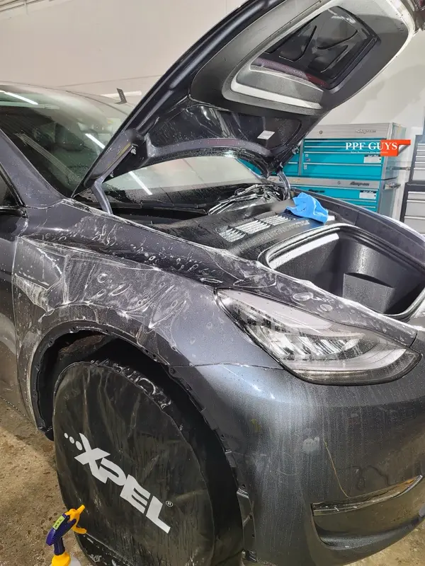Silver Tesla Model Y, PPF. Photo 13 of 25.