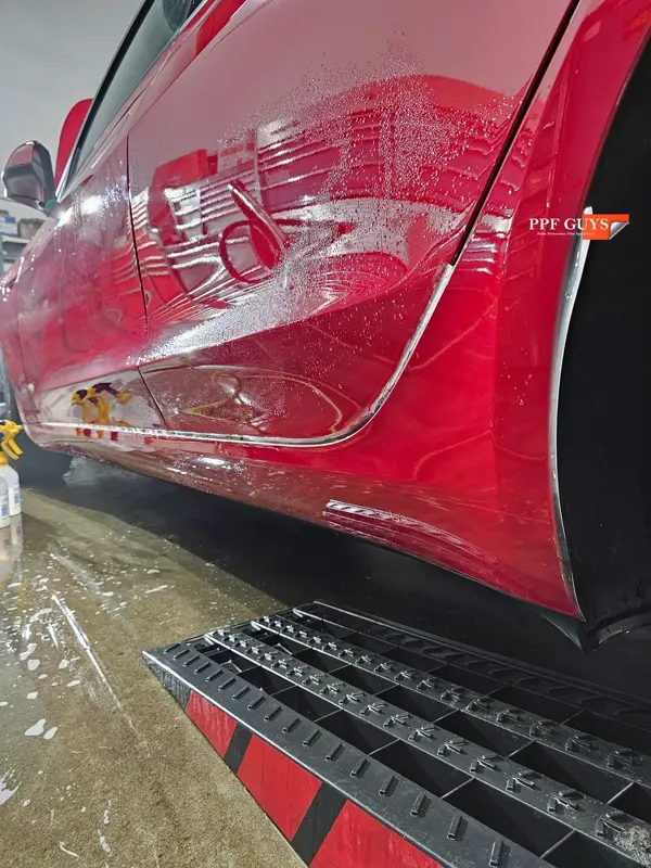 Red Tesla Model 3, Front end, partial A-pillars and rockers. Photo 21 of 30.