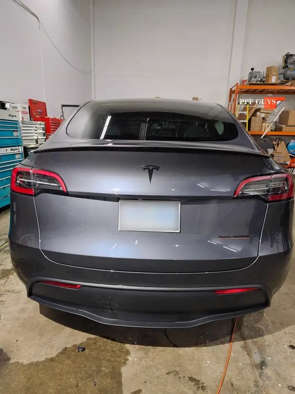 Silver Tesla Model Y, Full body Ultimate Fusion, blacked out emblems. Photo 38 of 45.