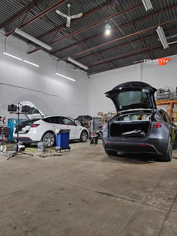 Silver Tesla Model Y, Full body Ultimate Fusion, blacked out emblems. Photo 14 of 45.