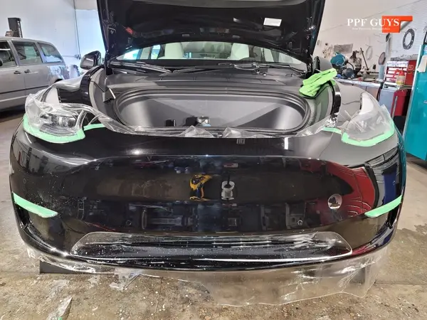 Black Tesla Model Y, Front end. Photo 9 of 14.