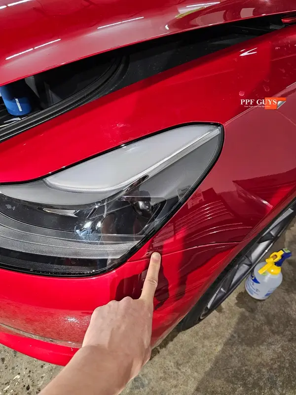 Red Tesla Model 3, Front end, partial A-pillars and rockers. Photo 27 of 30.