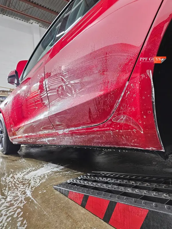 Red Tesla Model 3, Front end, partial A-pillars and rockers. Photo 20 of 30.