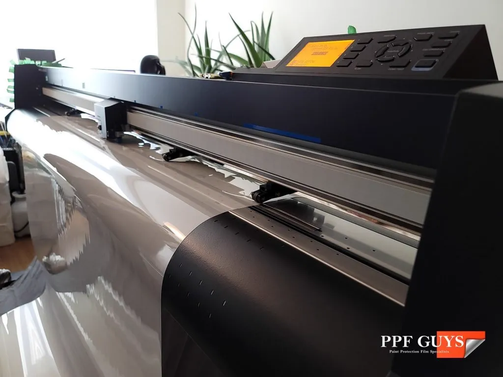 Paint protection film being cut on the PPF Guys plotter.