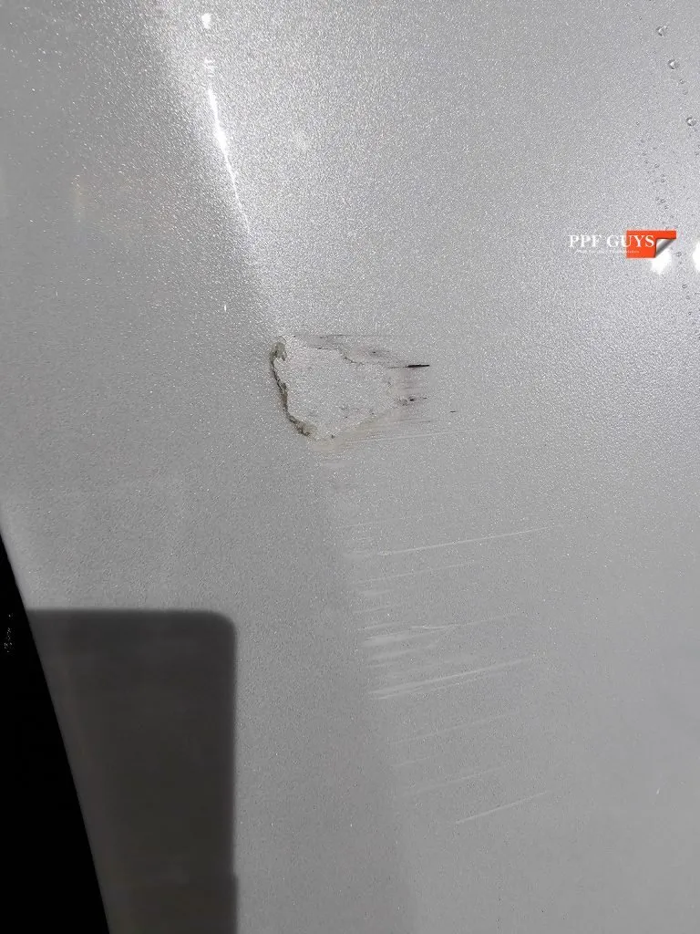 Close up of the damaged film on the bumper side.